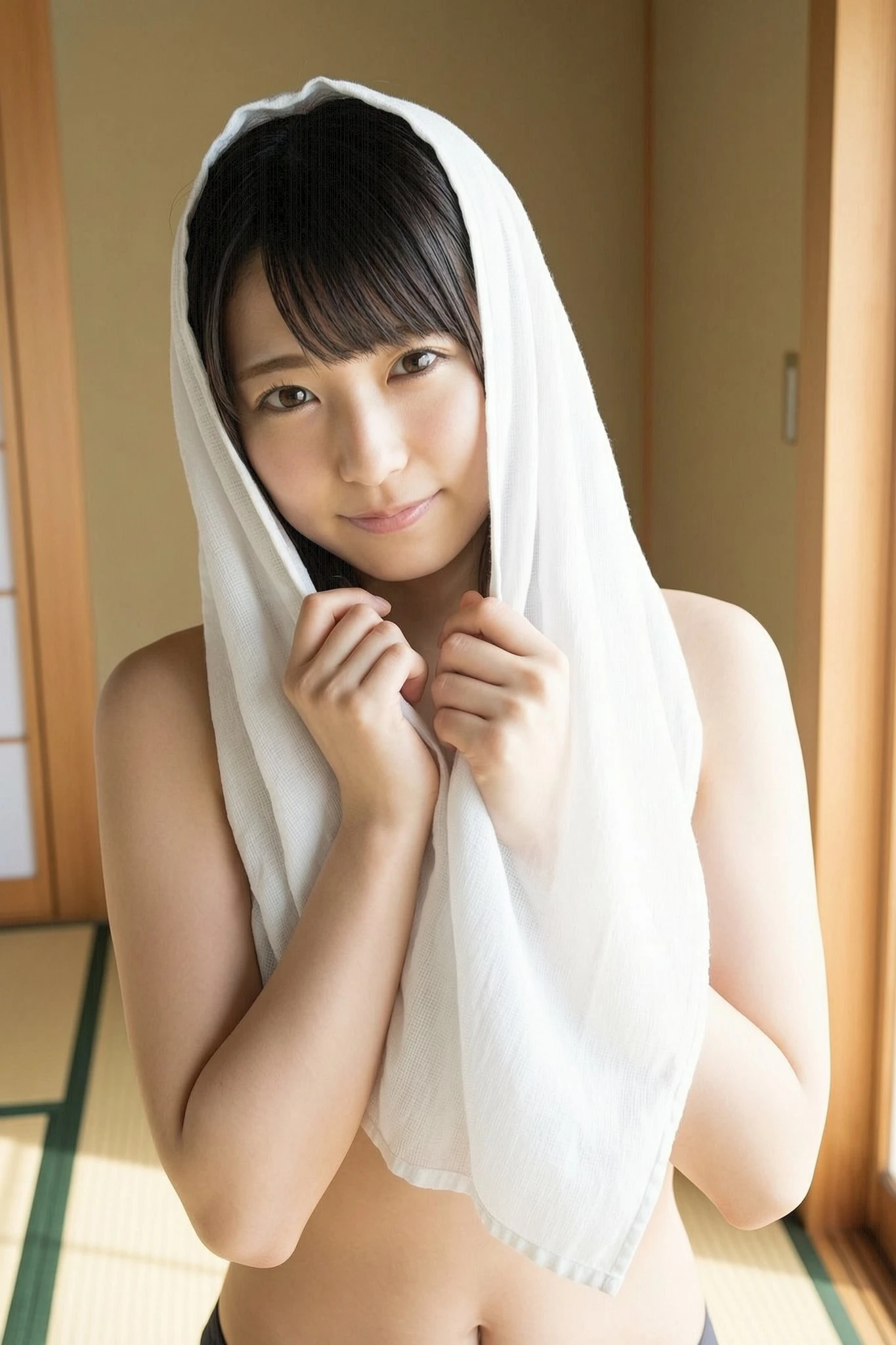 Wan 2.7 Image — Soft Beauty Portrait Soft beauty portrait of a woman with a towel over her head for Wan image portrait examples